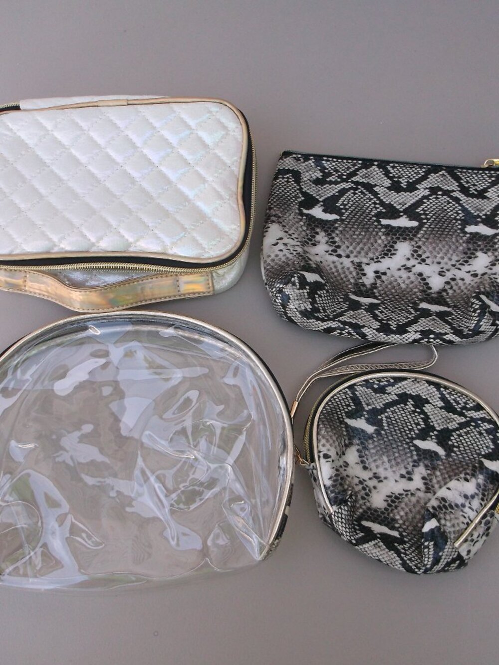 NWT 4‑Piece Cosmetic Bag Bundle — Quilted White w/ Charms + 3 additional bags